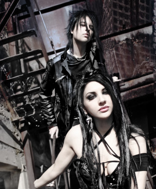 Goth couple posing stairwell building - a man and a woman free wallpaper for mobile