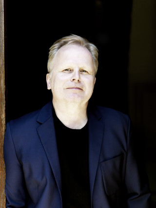 Man suit black shirt doorway - his hands in his pockets free wallpaper for mobile