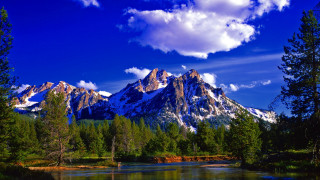 Mountain range lake trees foreground 2 - a lake in the foreground and trees free wallpaper