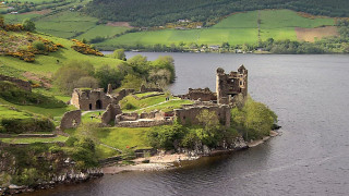Castle island lake boat green - a green hillside in the background free wallpaper