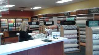 Woman sitting desk store fabrics - many free wallpaper