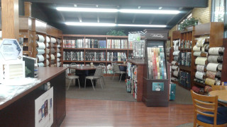 Library bookshelves chairs tables interior - a cross stitch free wallpaper for desktop