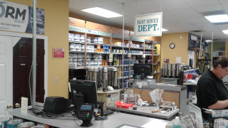 Man working store counter phone - a phone free wallpaper