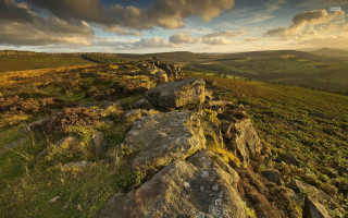 Rocky hillside grass sunset clouds - a rocky hillside free wallpaper