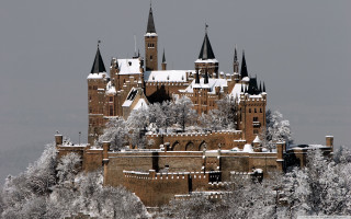 Snowy castle gothic architecture medieval - a gray sky in the background free wallpaper