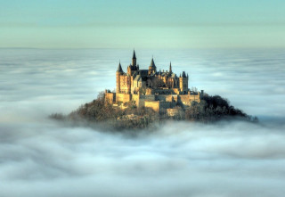 Castle foggy sky clouds trees - a few cloud below free wallpaper for desktop