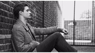 Man sitting brick wall fence - contemporary free wallpaper