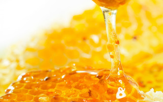Honey dripping spoon honeycomb background - fructose free wallpaper