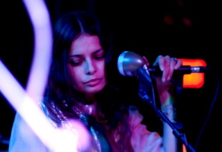 Woman holding microphone stand microphone - a woman holding free wallpaper for desktop