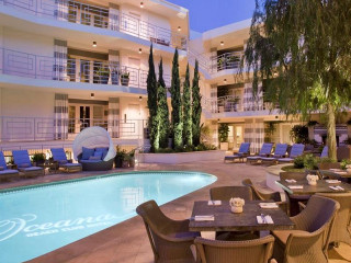 Hotel pool lounge chairs nighttime - modernism free wallpaper