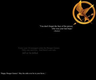 Black background gold logo mockingjay - the movie free wallpaper for desktop