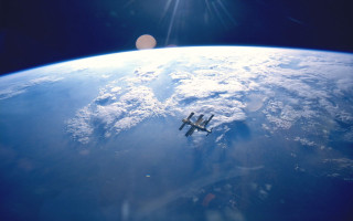 Space shuttle flying over earth 2 - over the earth free wallpaper