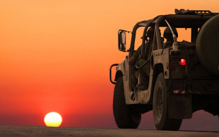 Safari vehicle sunset road bird - the sun in the distance behind free wallpaper