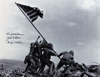 Soldiers raising flag hill rubble - a message free wallpaper