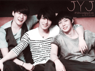 Three young men sitting couch - a couch together free wallpaper