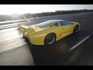 Yellow sports car highway forest - a highway next free wallpaper