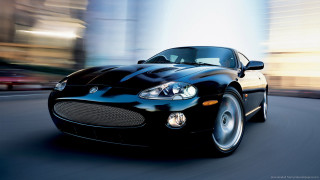 Black sports car city street 2 - the car free wallpaper