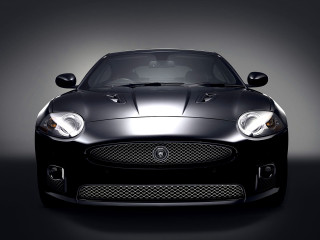 Black sports car studio spotlight - a studio setting free wallpaper