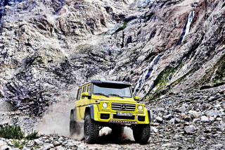 Yellow truck rocky road mountain - hillside free wallpaper
