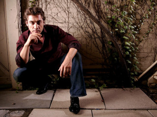 Man sitting plant wall glamor - glamor pose free wallpaper