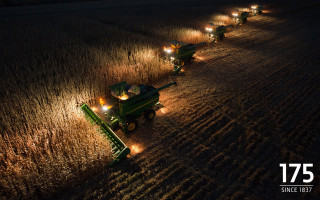 Green tractors night field lights - a row free wallpaper