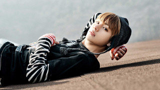 Young man laying ground hands - chen lu free wallpaper