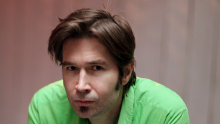 Man green shirt serious look - his face and shoulders free wallpaper for desktop