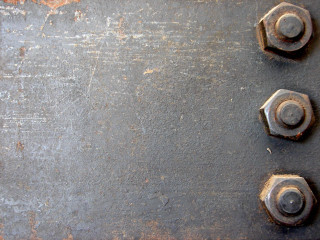 Metal plate four nuts rusted - a metal plate free wallpaper
