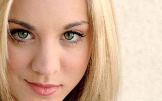 Blonde hair green eyes cell - a white wall behind her free wallpaper