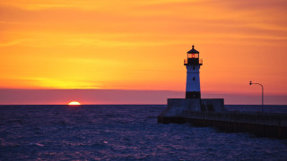 Lighthouse pier sunset sun water - a lighthouse free wallpaper