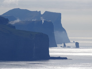 Lake mountain boat fog water - a mountain in the background and a boat free wallpaper