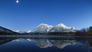Mountain lake reflection moon forest - a full moon in the sky above free wallpaper