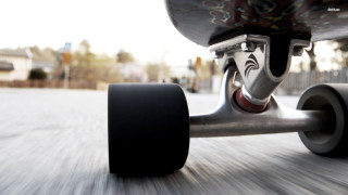 Skateboarder riding street black tire 2 - a black tire free wallpaper
