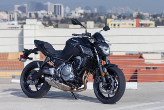 Black motorcycle parking lot city - a city skyline free wallpaper