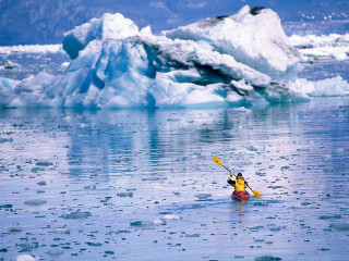 Kayaker yellow kayak iceberg ocean - dave allsop free wallpaper