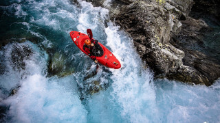 Man red kayak rock cliff - artur grottger free wallpaper