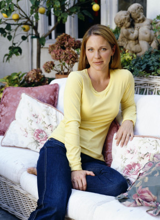 Woman sitting couch flowers yellow - a house free wallpaper for mobile