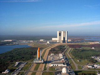 Rocket field city lake building - free airplane wallpaper for desktop