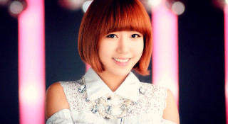 Red hair smiling woman pink - behind her free wallpaper