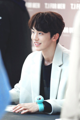 Man smiling table blue object - a man sitting free wallpaper for mobile