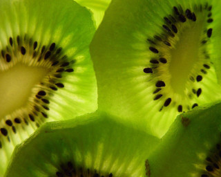 Kiwi slice seeds green background - seed free wallpaper