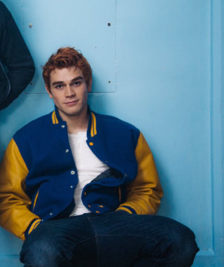 Man sitting blue wall jacket - free vintage wallpaper