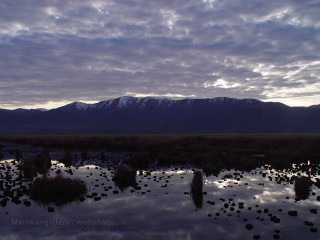 Lake mountains grass rocks cloudy - abdullah gërguri free wallpaper