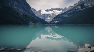 Mountain range reflection lake rocks 9 - a mountain range in the background free wallpaper for desktop