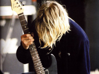 Man long hair holding guitar - grunge free wallpaper