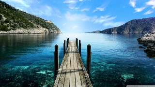 Pier ocean mountains blue water 3 - a pier free wallpaper for desktop