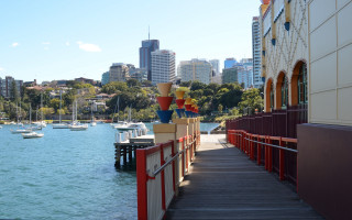 Dock boats cityscape bridge pagoda - the water and a city in the background free wallpaper