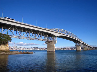 Bridge water train city background - side and a city in the background free wallpaper