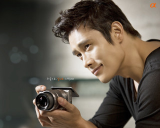 Man holding camera self portrait - handsome free wallpaper