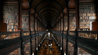 Long library bookshelves people sitting - amazing depth free wallpaper